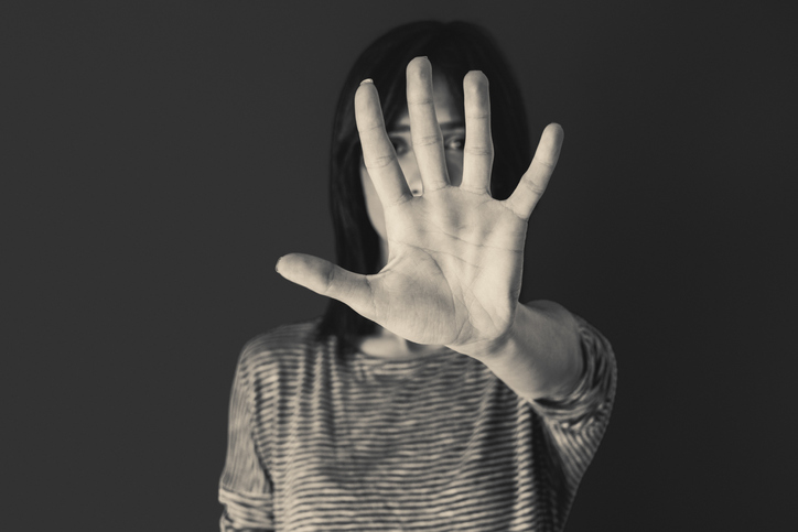 Woman making stop gesture with her hand