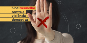 banner da campanha Sinal Vermelho, com a foto de uma mulher, com a mão espalmada, com um X vermelho pintado, em frente ao rosto