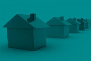Imagem de casas de blocos enfileiradas sob um filtro de cor verde.