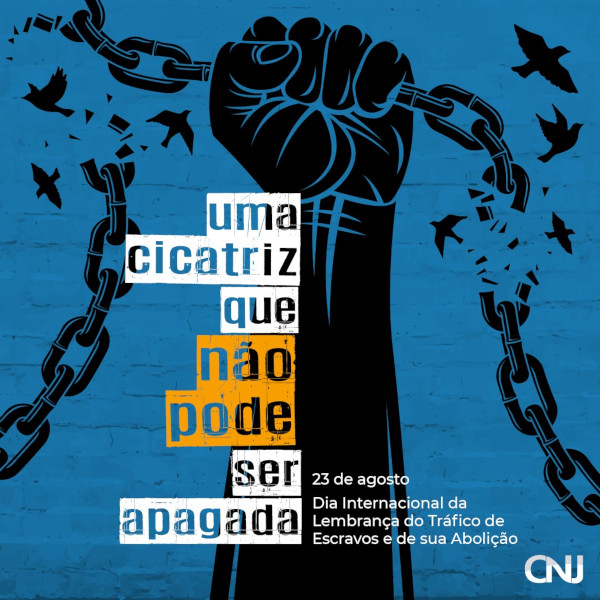 Ilustração de uma mão segurando uma corrente quebrada em dois pontos onde aparecem pássaros voando. Ao fundo, textura azul. Texto: Uma cicatriz que não pode ser apagada. 23 de agosto - Dia Internacional da Lembrança do Tráfico de Escravos e de sua Abolição.